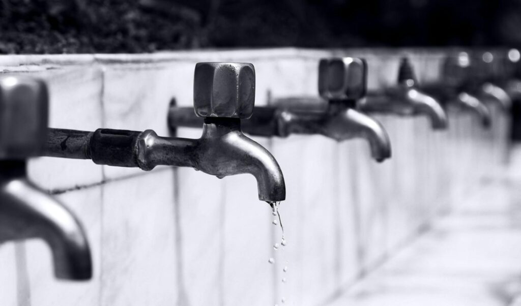 water drops from faucet